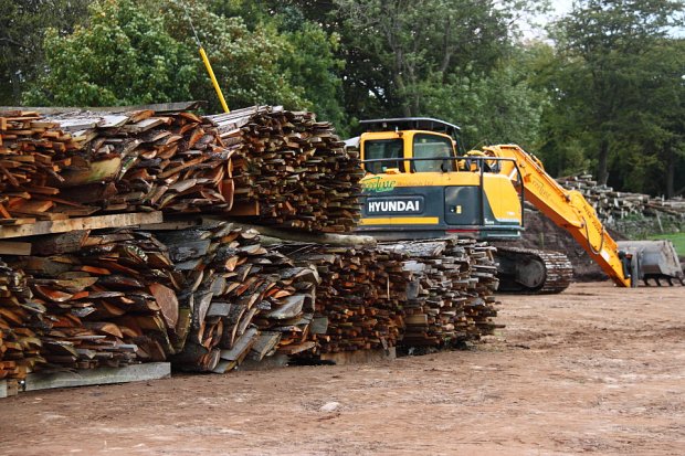 First timber into the yard, a row of biomass bales drying on bearers