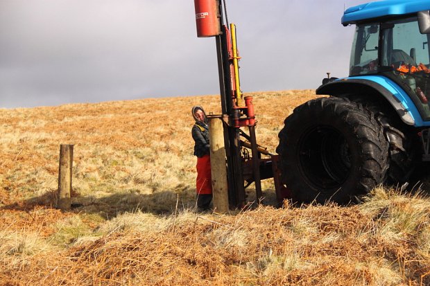 Damien knocking in strainers around one of the compartments